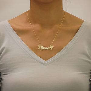 Model wearing custom 14k gold bird nameplate necklace on an 18-inch chain.