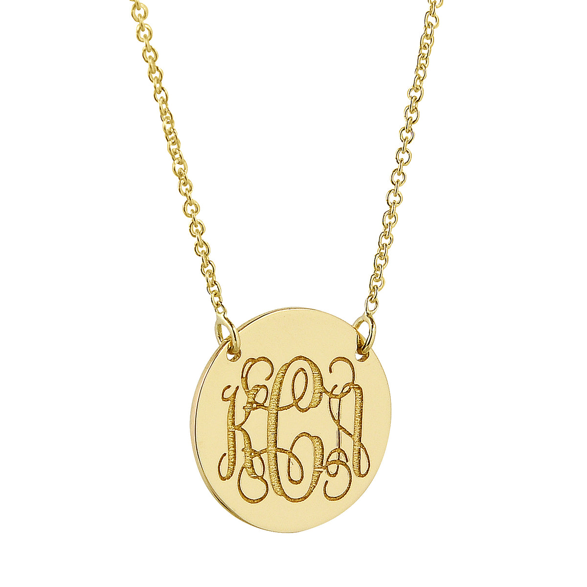 Close-up of a 1/2 inch solid gold monogram disc pendant featuring a Rolo chain.