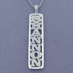 Close-up of genuine handset diamonds in solid gold vertical name pendant