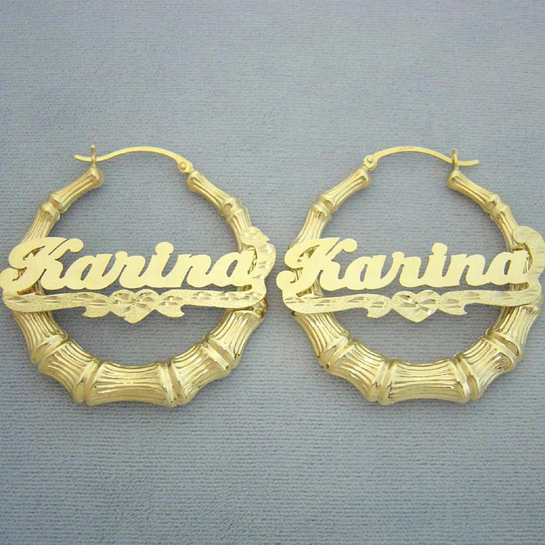 Pair of custom 14k gold personalized bamboo hoop earrings with diamond-cut heart underline