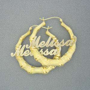Custom 10k or 14k gold personalized iced out bamboo name hoop earrings with two-tone rhodium cursive script