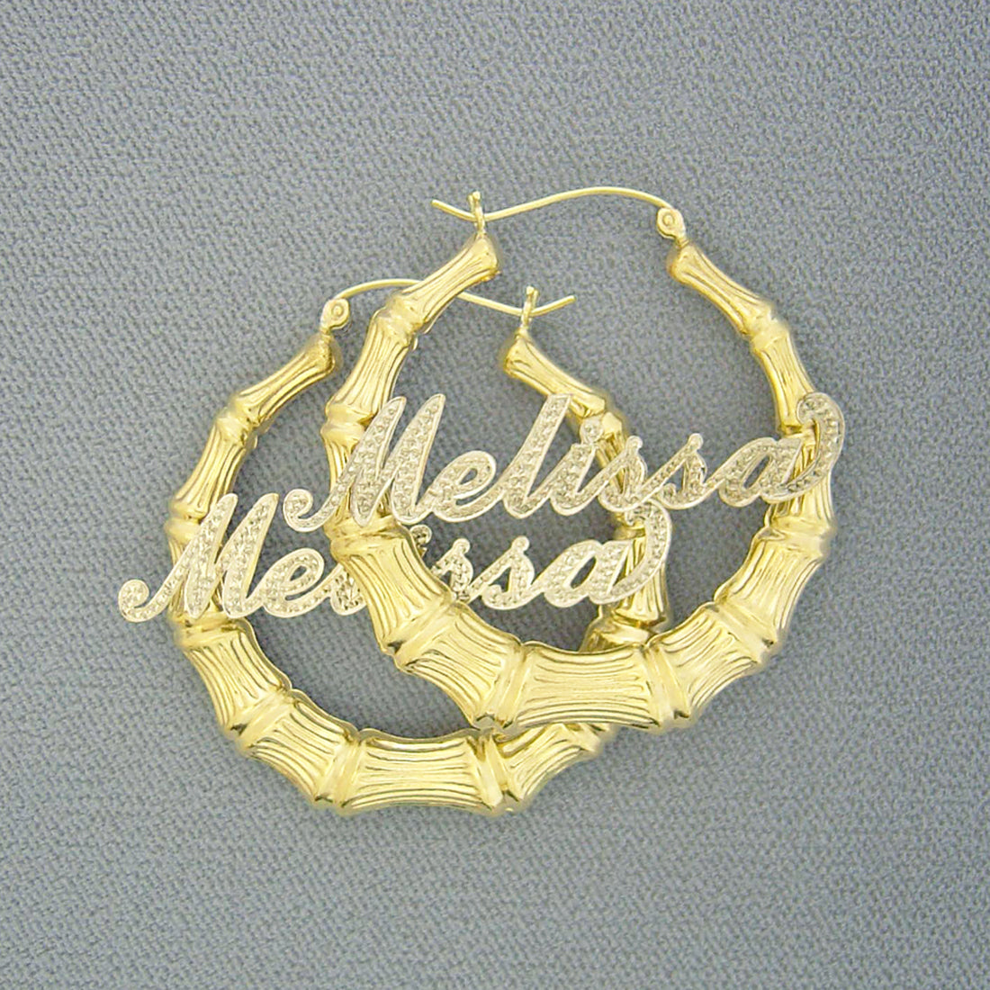 Custom 10k or 14k gold personalized iced out bamboo name hoop earrings with two-tone rhodium cursive script