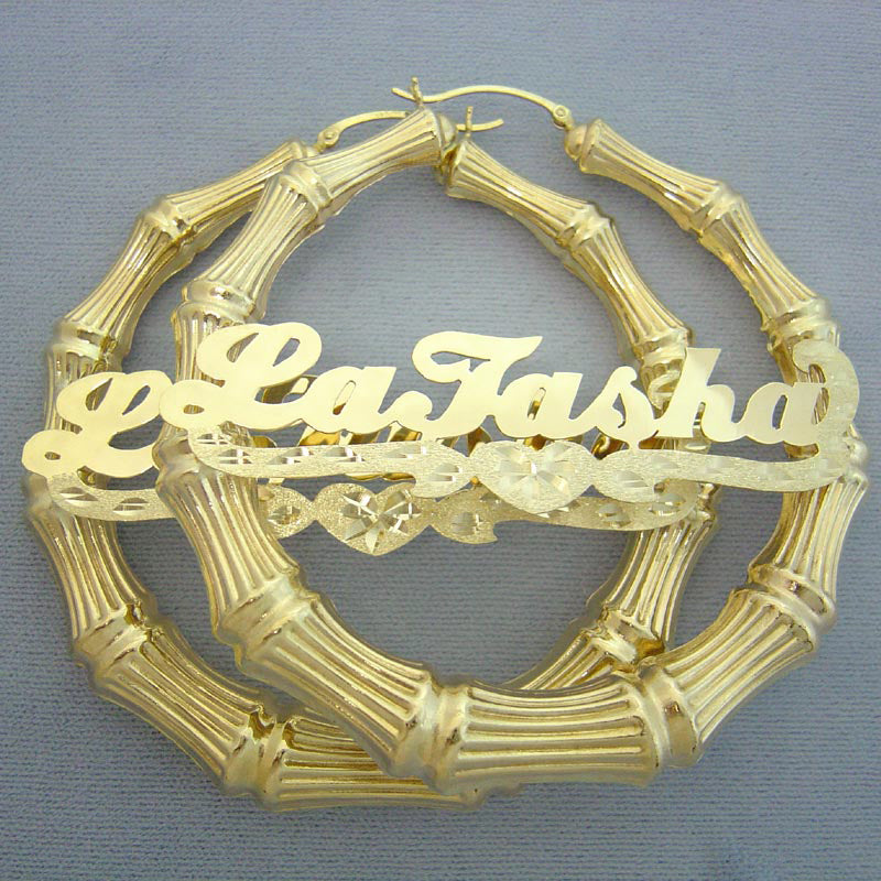 Pair of personalized 10K and 14K gold bamboo hoop earrings with cursive nameplate and heart accent