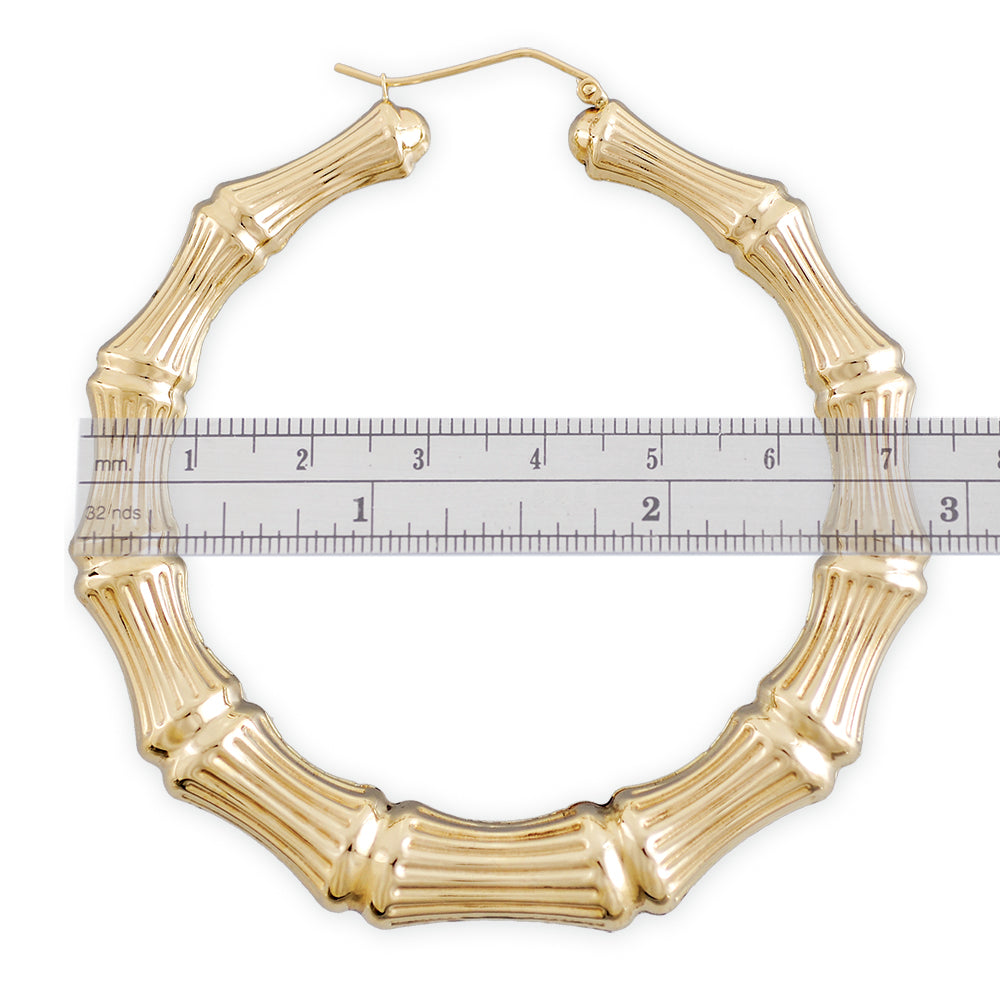 Close-up of clip closure on 14k gold hollow bamboo hoop earring