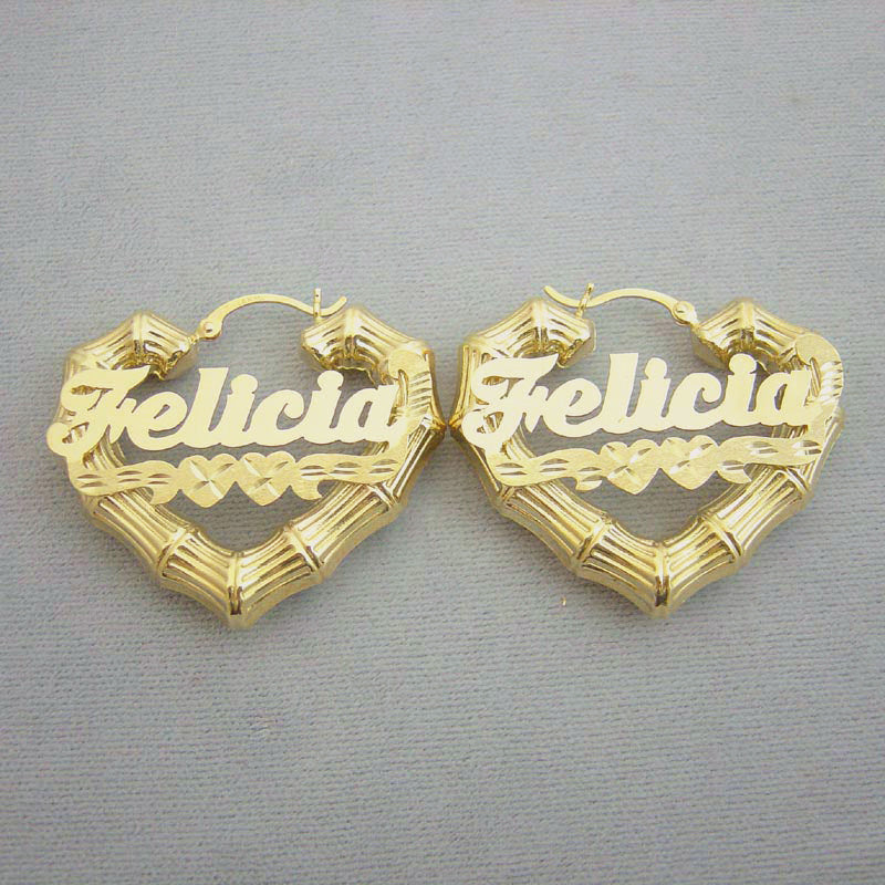 Pair of custom 10k or 14k gold heart bamboo hoop earrings featuring cursive name plates reading Felicia with double center hearts