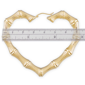Detail of 10k 14k real gold puffed hollow skinny heart bamboo earring with clip closure