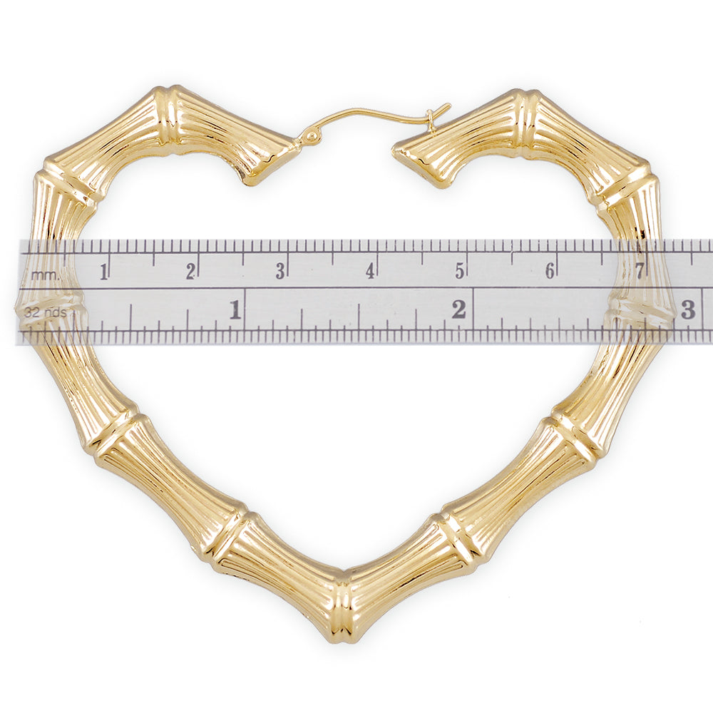 Detail of 10k 14k real gold puffed hollow skinny heart bamboo earring with clip closure