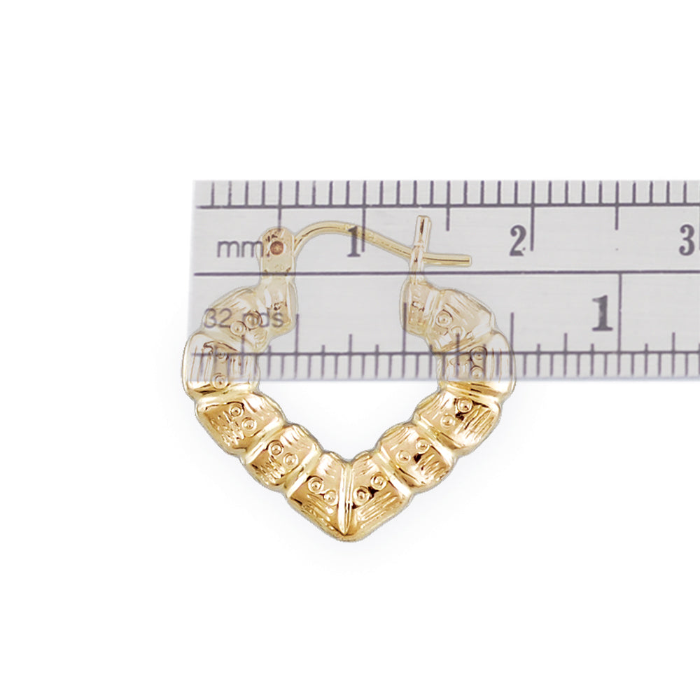 Close-up of 10K gold puffy heart bamboo earring showing texture and clip closure