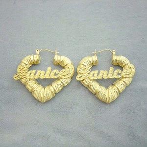 Pair of 10K yellow gold personalized puffy heart bamboo name earrings with custom diamond-cut cursive lettering