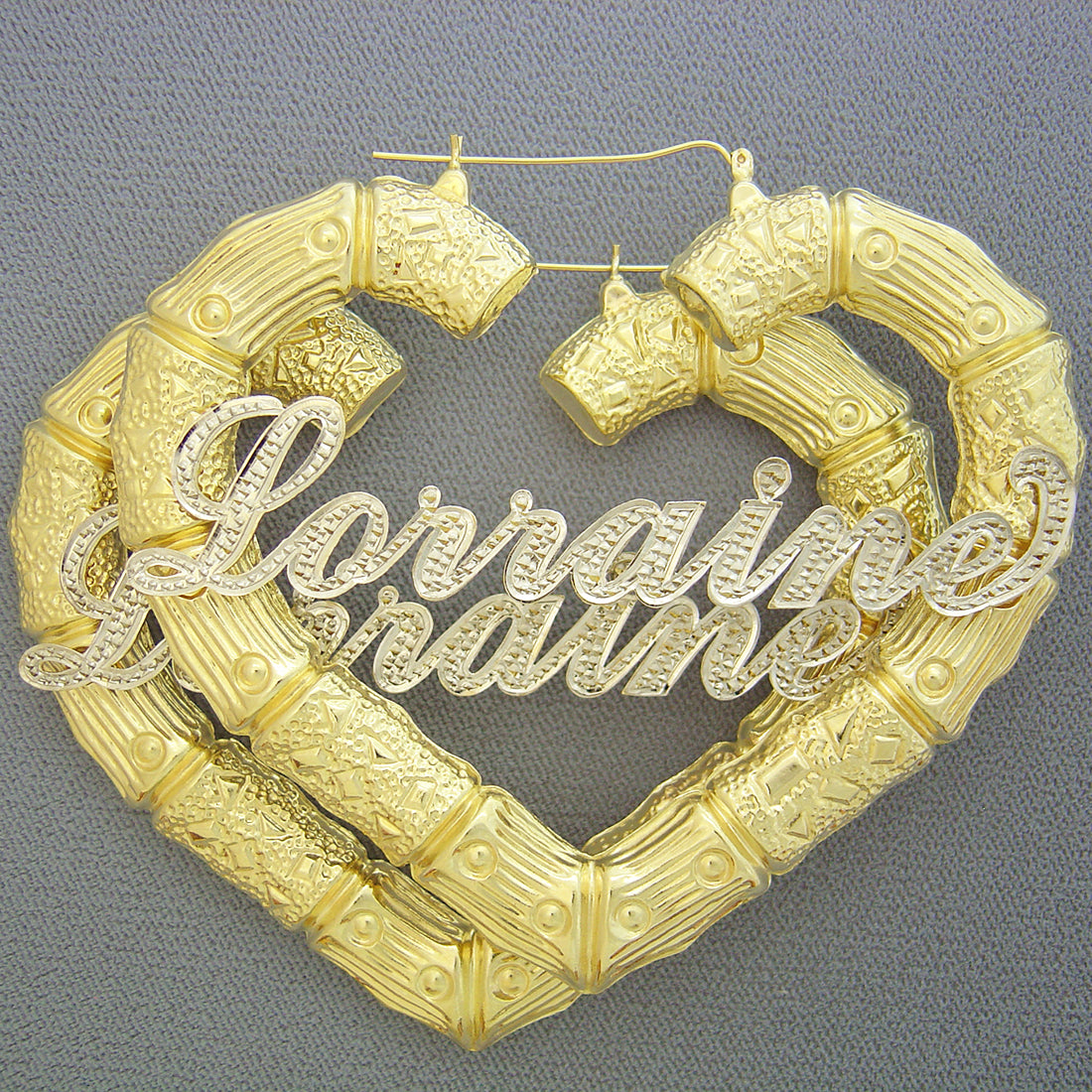 Custom 10K two-tone gold puffy heart bamboo hoop earrings with personalized cursive nameplate and diamond accents