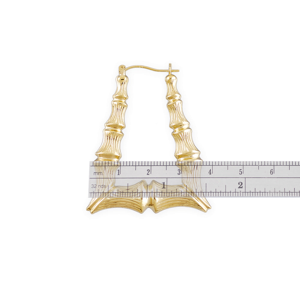 Snap bar closure detail on 10k gold rectangle doorknocker bamboo earrings