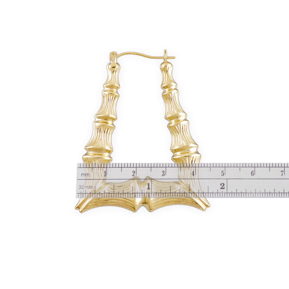 hollow design and clip-back closure of 10K gold rectangular bamboo hoop earrings