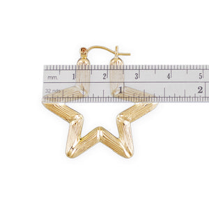 10K gold star bamboo hoop earring measured with ruler showing 1.38 inch diameter