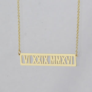 Custom solid gold horizontal bar pendant necklace with Roman numeral date laser engraving