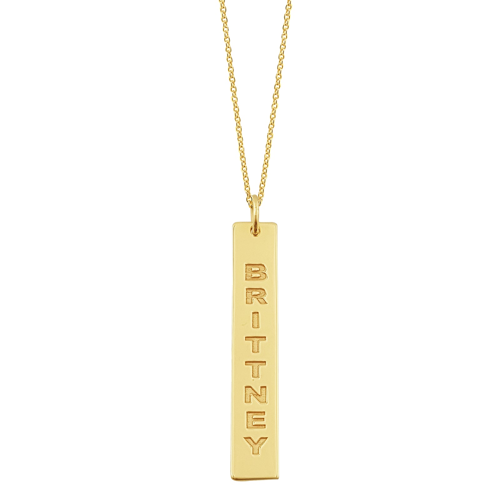 Close-up view of deep laser engraving on a 1.25 inch solid gold vertical bar pendant