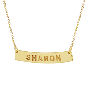 Dainty 10k yellow gold horizontal curved bar necklace engraved with SHARON on a slim rolo chain