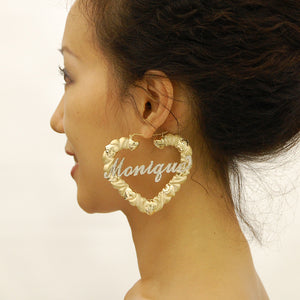 On-Model / Scale View: 3-inch 10K gold personalized iced out name heart hoop earrings shown for size