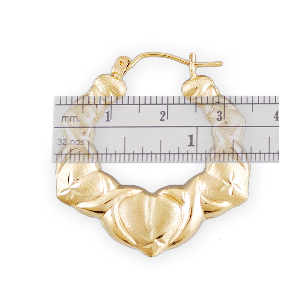 Close-up of diamond cut detail on 10k gold XO heart earrings