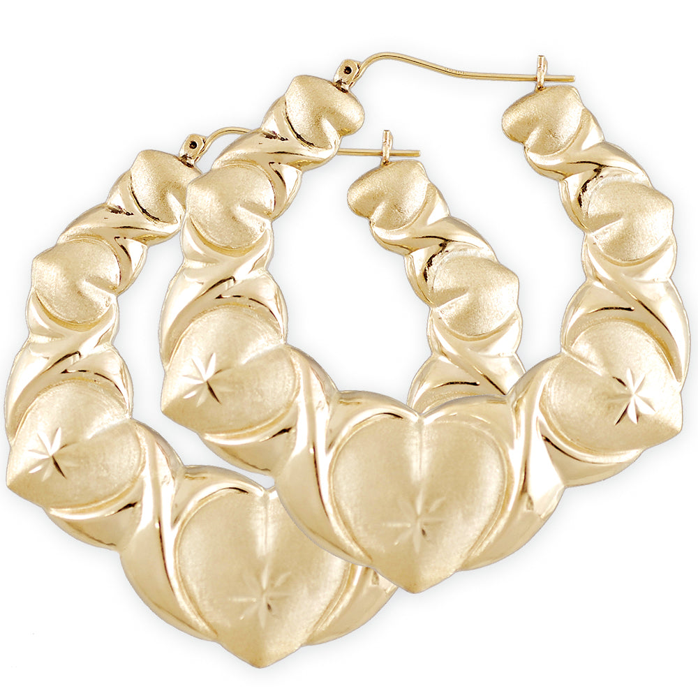 10K yellow gold XO heart puffy doorknocker earrings with diamond-cut pattern