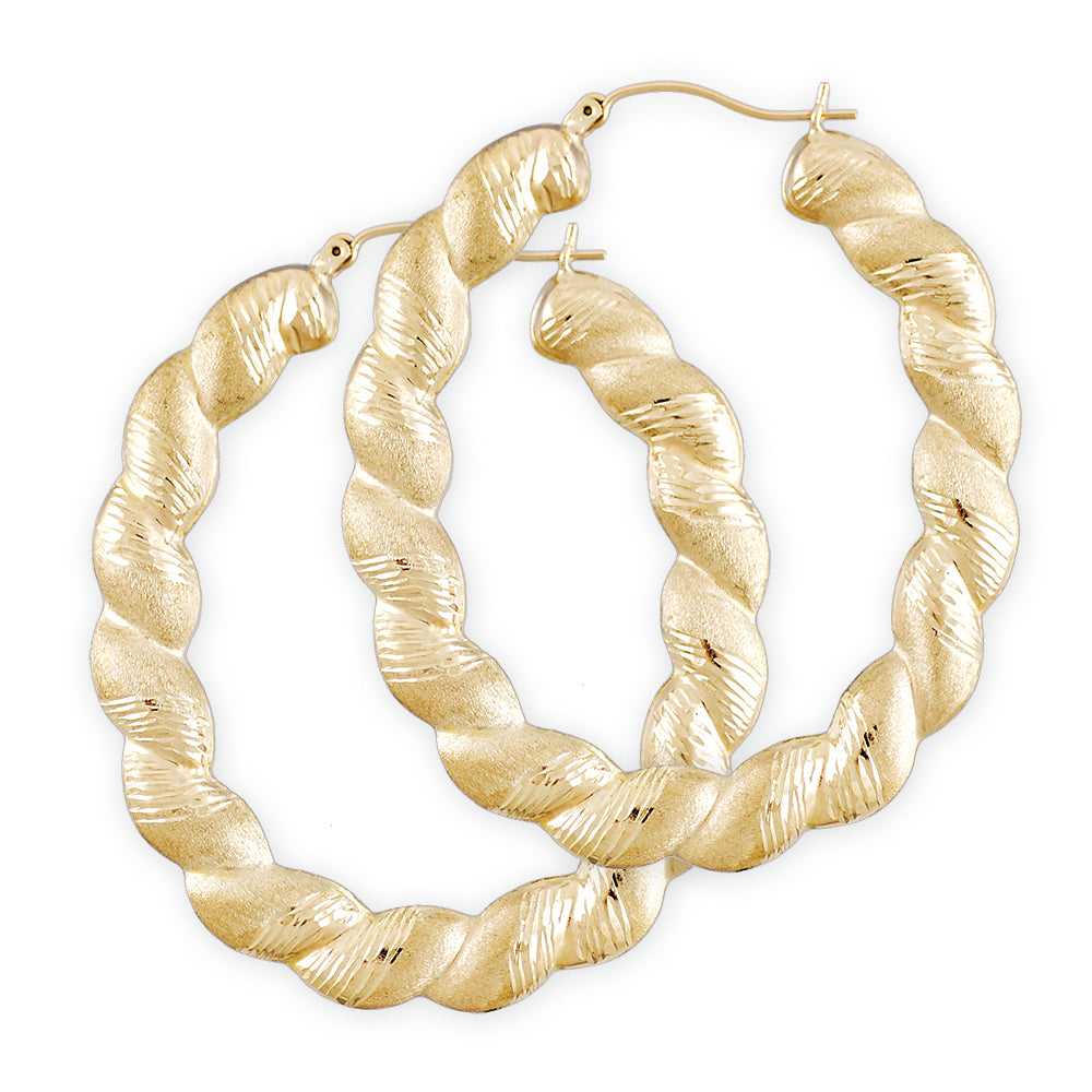 A pair of 10k yellow gold twisted diamond cut door knocker oval shape hollow drop down earrings with clip enclosures.