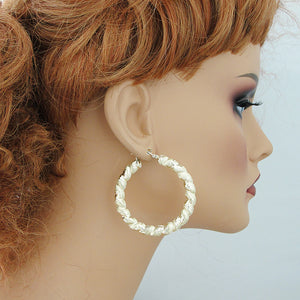 2-Inch Hollow 10K Gold Door Knocker Hoop Earrings on mannequin.