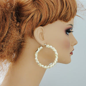 wearing 2.25 inch 10k yellow gold twisted puffy door knocker hoop earrings