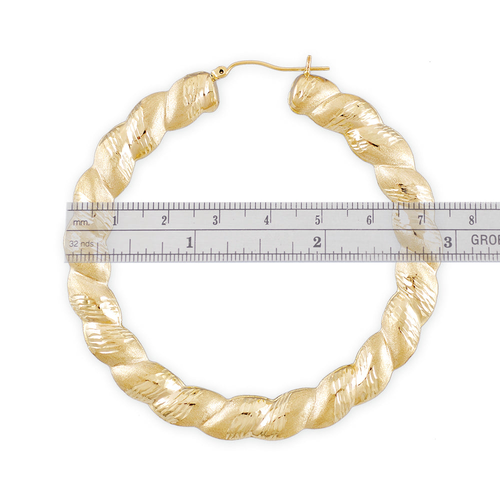 Close-up of diamond cut pattern on 10kt gold twisted door knocker hoop