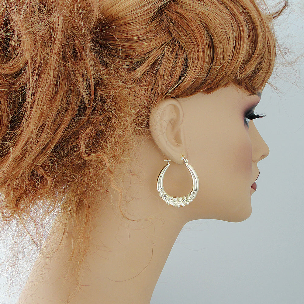 wearing 10k yellow gold wheat door knocker hoop earrings