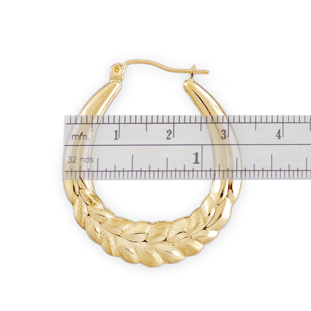 Close-up detail of 10k yellow gold wheat pattern texture and clip-top closure