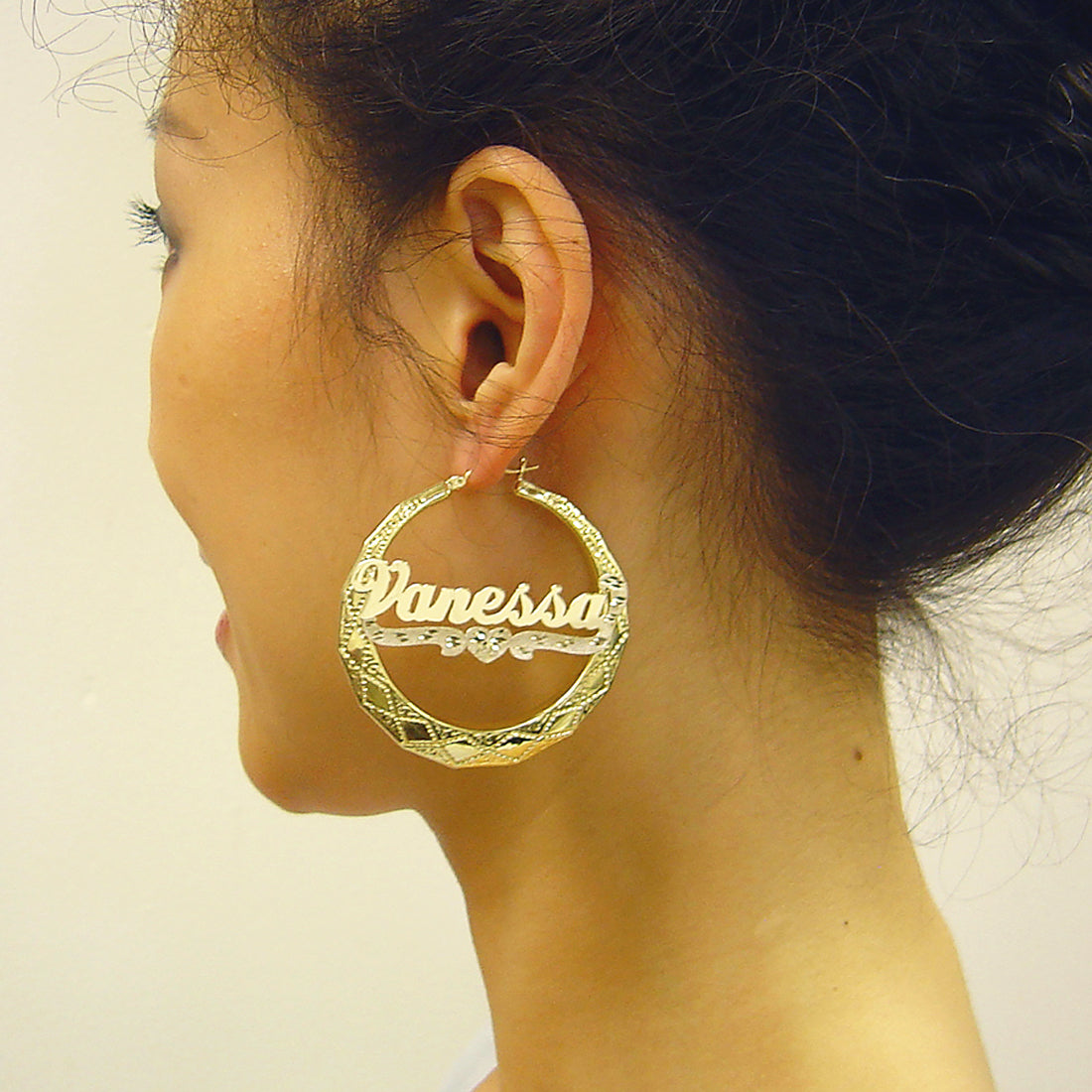 10K real gold personalized name door knocker hoop earrings with cursive lettering and diamond-cut heart design on model