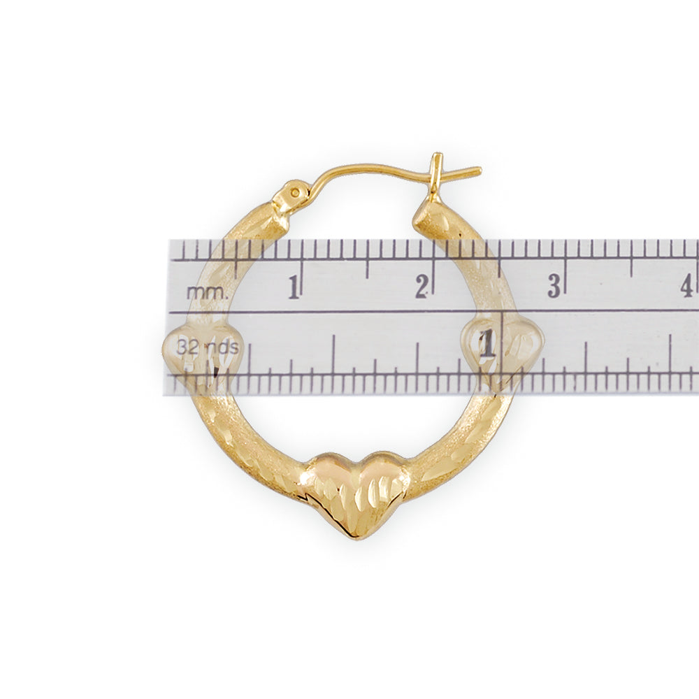 10K gold three hearts doorknocker earrings showing 1.1 inch length measurement