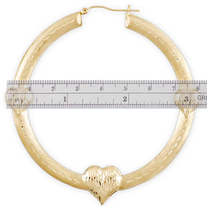 snap enclosure of 10k gold puffy heart hoops
