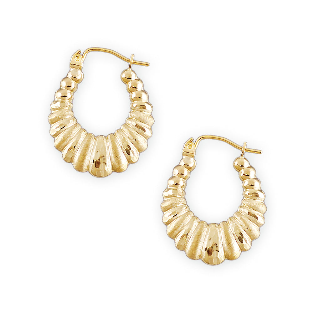 A pair of 10kt gold diamond cut shrimp puffy hollow earrings with clip enclosures.