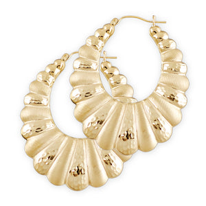 A pair of 10k gold hollow puffy shrimp doorknocker earrings with diamond cuts, approximately 1 3/4 inch wide.