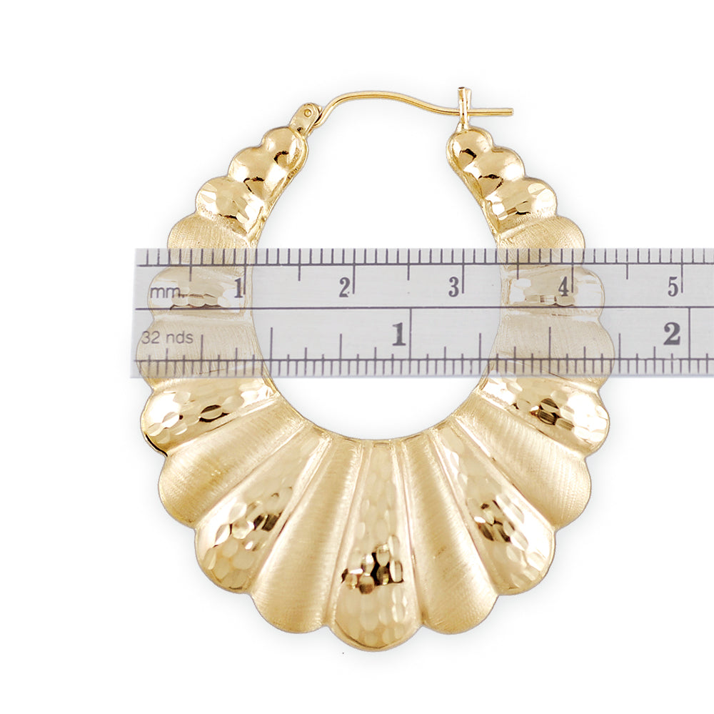 Close-up of secure hinged snap-bar closure on 10K gold shrimp door knocker earrings