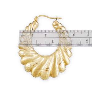 Close-up of hinged snap closure on 10k gold door knocker hoop earring