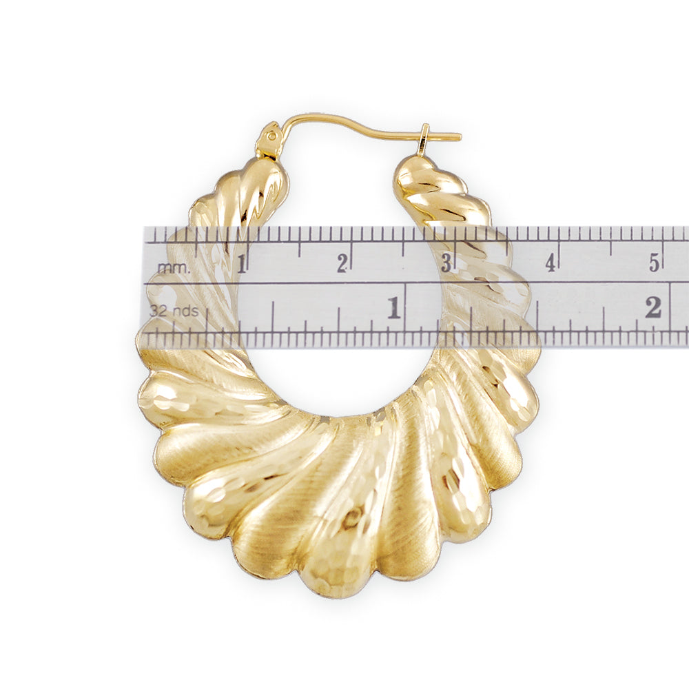 Close-up of hinged snap closure on 10k gold door knocker hoop earring