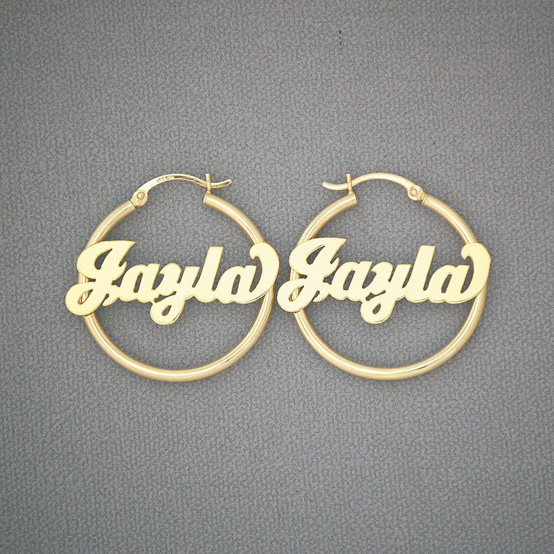 Custom 14K solid yellow gold 2mm tube name hoop earrings in bold cursive lettering, 30mm diameter