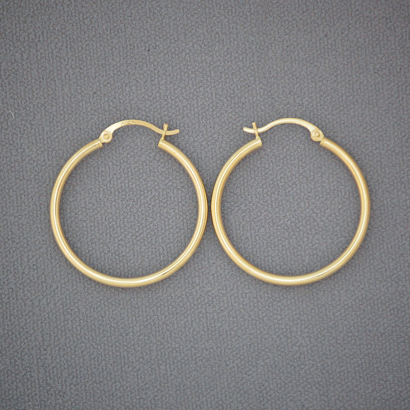 Pair of 14K yellow gold 2mm classic hollow hoop earrings with high polish finish, 30mm diameter