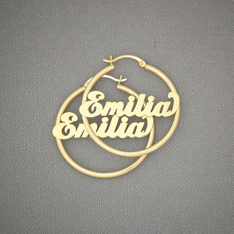 Pair of 14k yellow gold personalized name hoop earrings 35mm with shiny cursive lettering