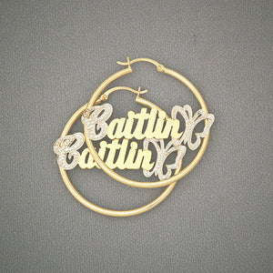 Pair of personalized 14k yellow gold 1.5 inch hoop name earrings with iced butterfly accent