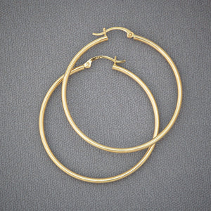 Pair of 14K yellow gold 2mm classic plain hoop earrings with 1.75 inch diameter