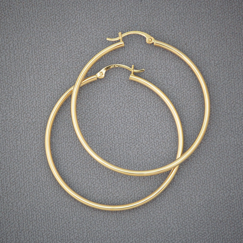 Pair of 14K yellow gold 2mm classic plain hoop earrings with 1.75 inch diameter