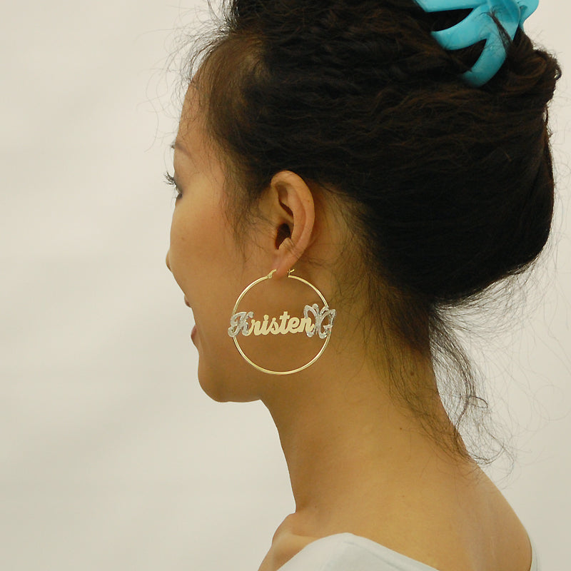 Side view of 14K two-tone gold iced-out butterfly name hoop earring showing 2mm tube thickness and snap closure