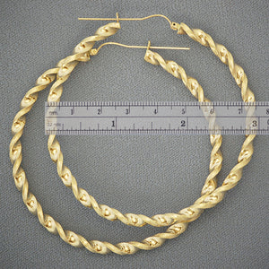 Pair of 10K yellow gold 4mm thick hollow twisted hoop earrings with hinged snap closure