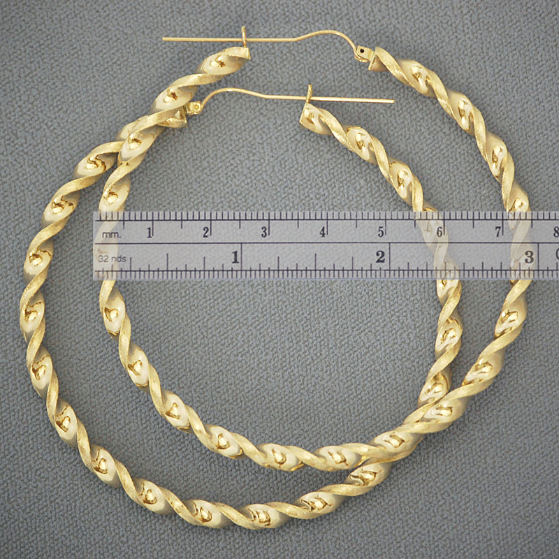 Pair of 10K yellow gold 4mm thick hollow twisted hoop earrings with hinged snap closure