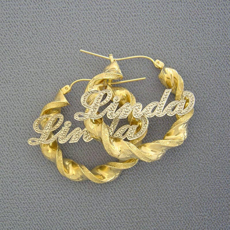 Custom 10k real gold iced out name hoop earrings featuring 6mm twisted design and two-tone diamond-cut finish with custom nameplate.