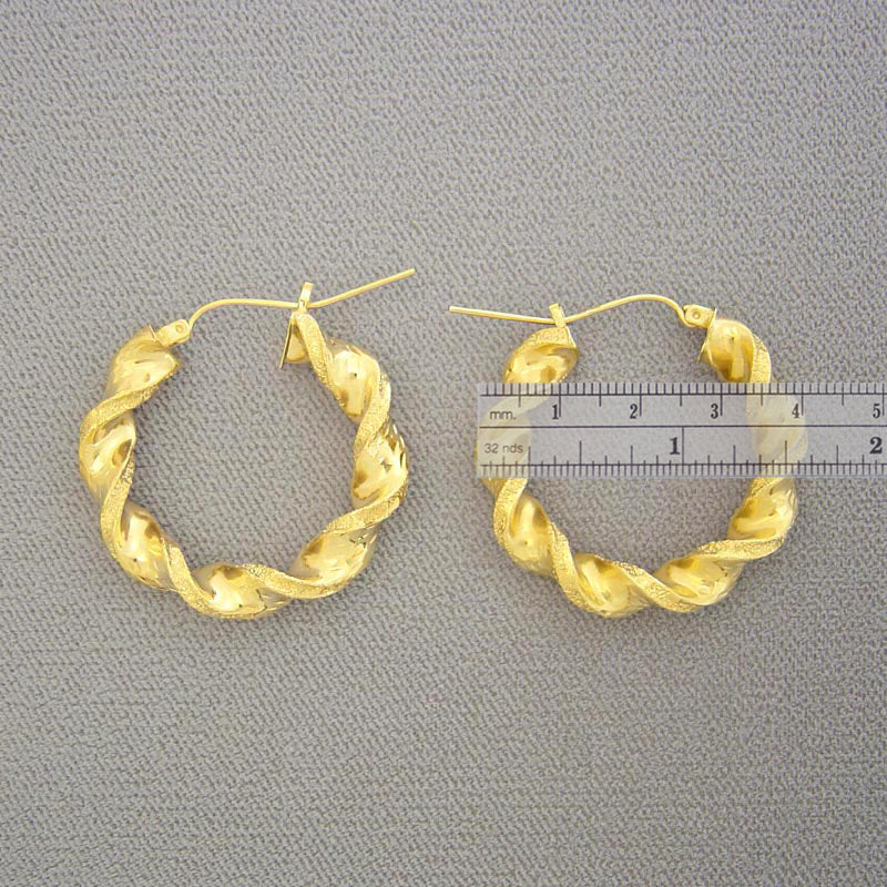 Pair of 10K real yellow gold 6mm hollow twisted hoop earrings with snap closure
