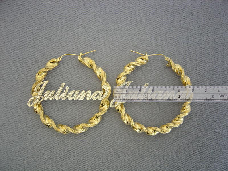 Close-up detail of 6mm two-tone twisted gold hoop and diamond accent custom nameplate