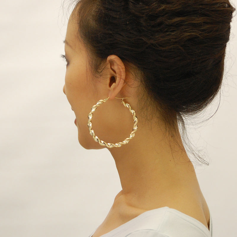 Side profile of 6mm thick 10K yellow gold twisted hoop earrings with clip closure